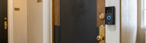 Apartment door 304 with a Ring video doorbell and brass lock